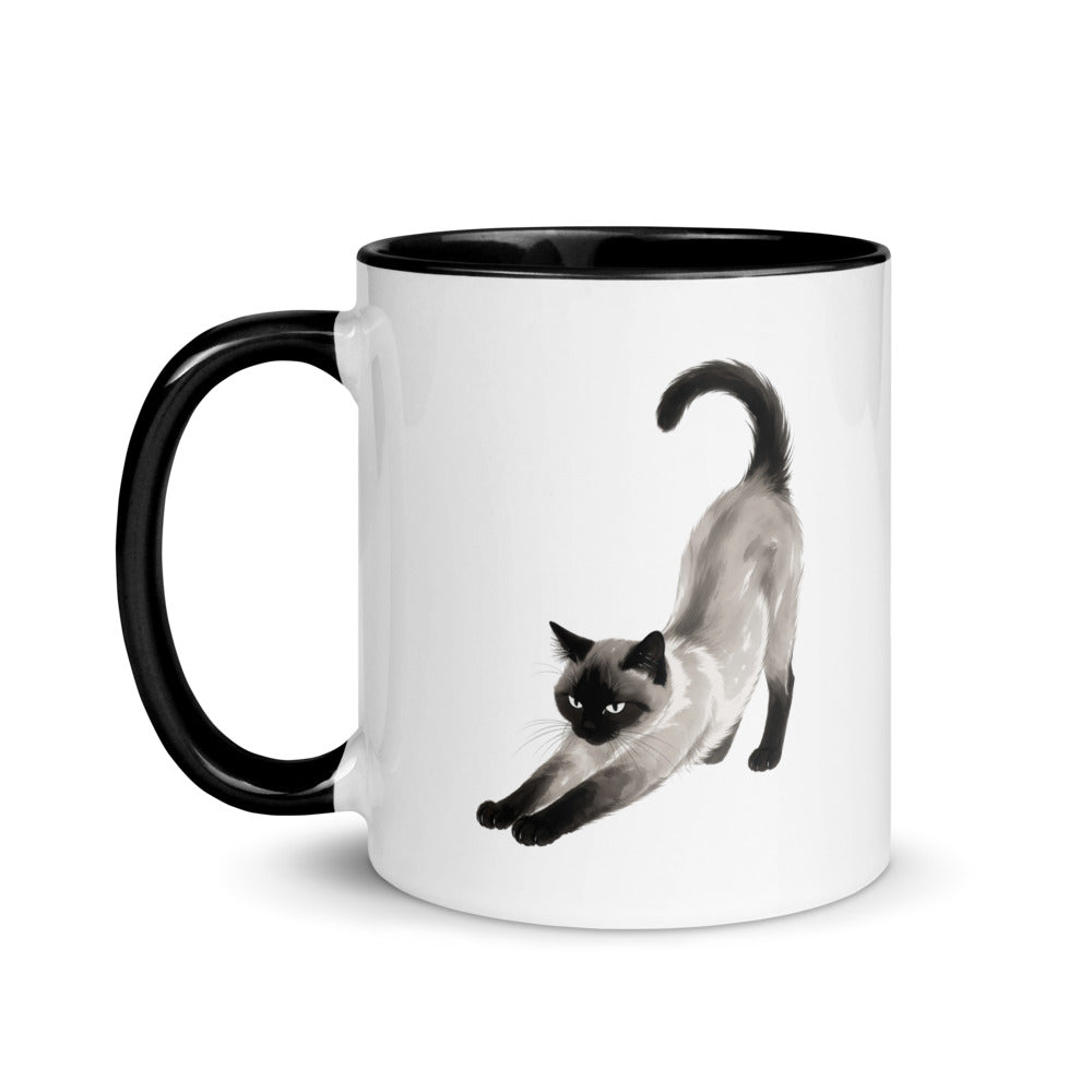 Stretching Siamese cat mug with black interior, handle on left
