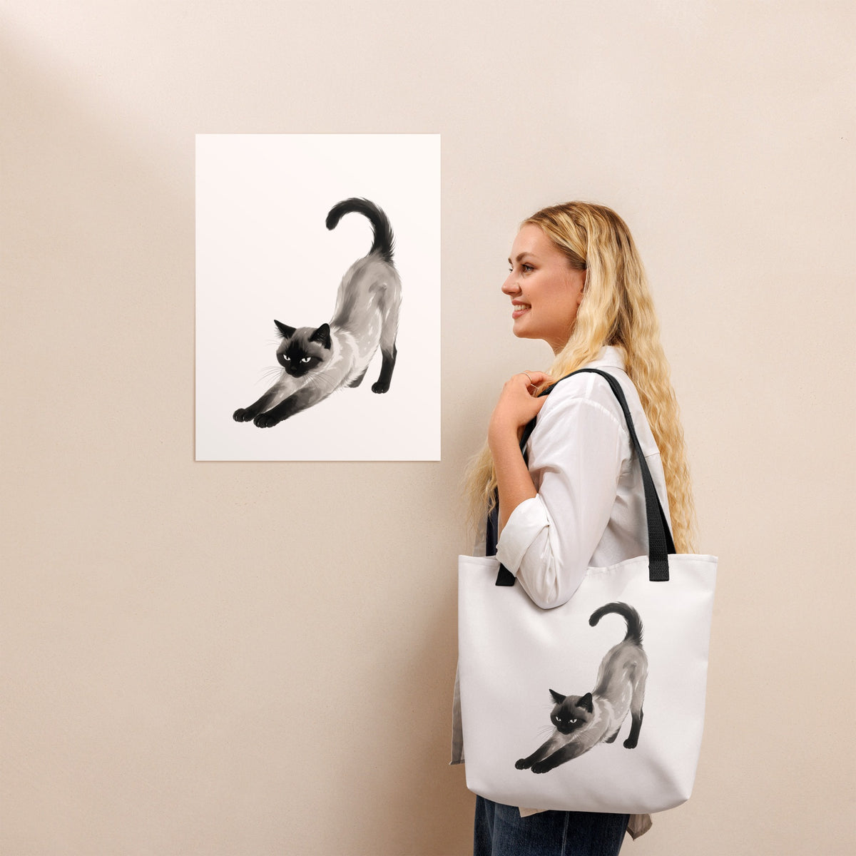 Woman holding the Stretching Siamese Cat Tote Bag, White